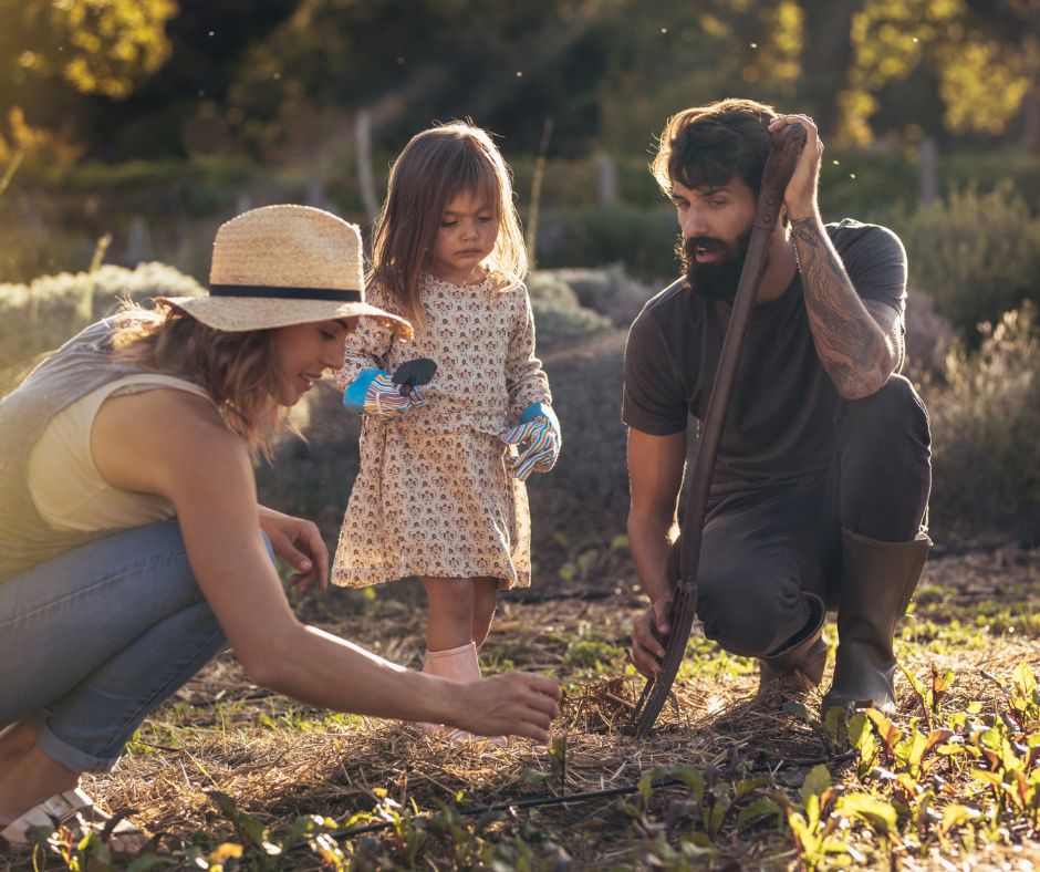 Family doing composting in garden